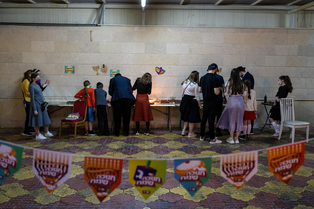 Jews light candles during Hanukkah at the Jewish Community Center in Dubai in December.