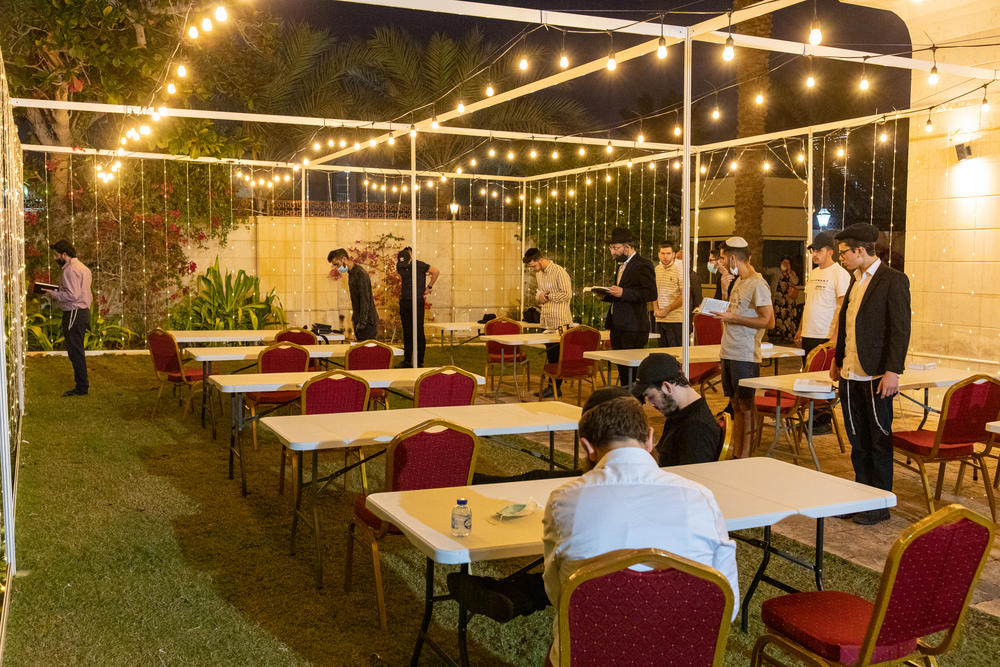 Jewish men pray during Hanukkah at the Jewish Community Center in Dubai on Dec. 17.