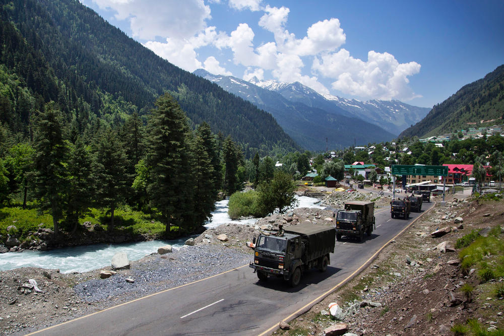 An Indian army convoy moves on the Srinagar-Ladakh highway at Gagangeer, northeast of Srinagar, India, on June 17. China said it was seeking a peaceful resolution with India following the death of 20 Indian soldiers in the most violent confrontation between the two countries in decades.