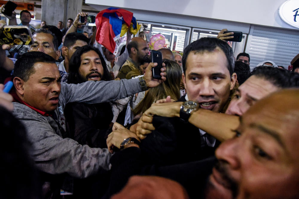 Opposition leader Juan Guaidó at Maiquetía Airport in February in Caracas. Guaidó returned to Venezuela after traveling to Colombia, Europe, Canada and the United States to try to gain support for his effort to oust President Nicolás Maduro. By year's end, Maduro remained in power and Venezuela near collapse.