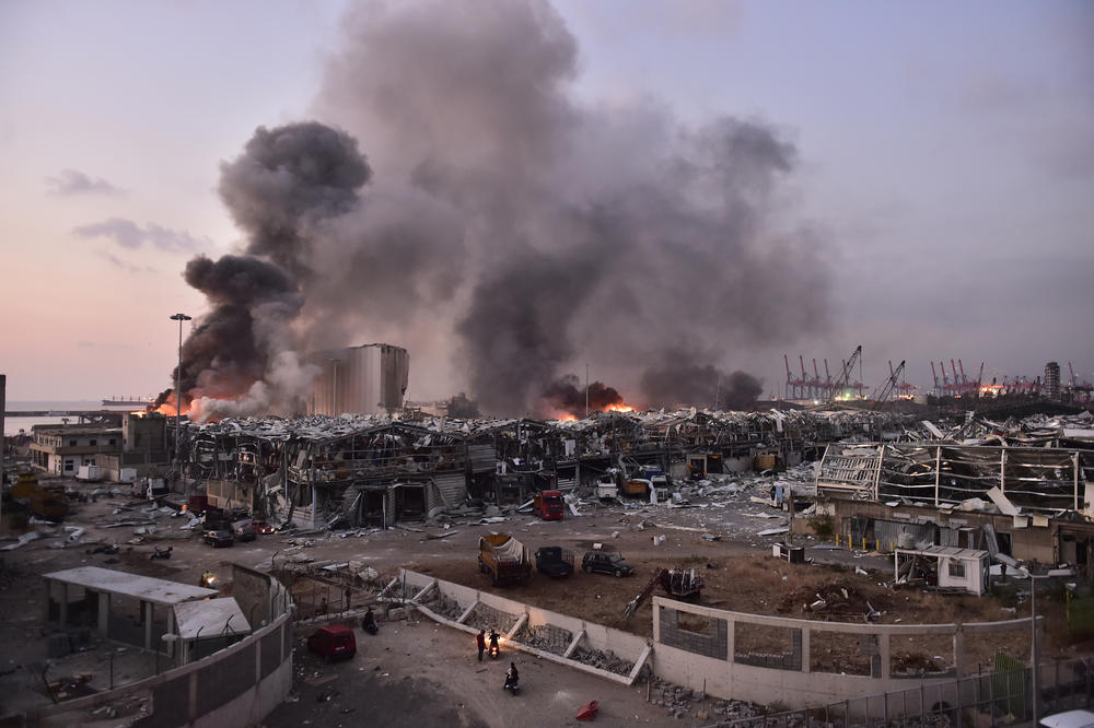 Smoke rises after a massive blast at the Beirut port on Aug. 4. The explosion killed nearly 200 people, wounded thousands and caused destruction across half the city. The blast was caused by a fire that ignited nearly 3,000 tons of ammonium nitrate stored in the port.