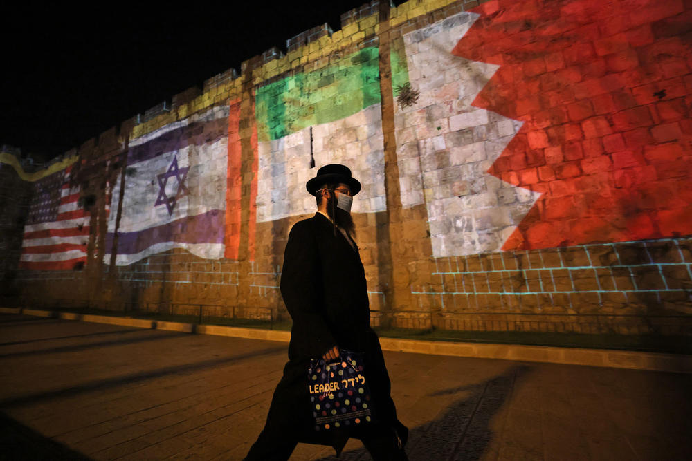 The flags of the U.S., Israel, United Arab Emirates and Bahrain are projected on the ramparts of Jerusalem's Old City on Sept. 15, in a show of support for Israel's normalization deals with the United Arab Emirates and Bahrain.