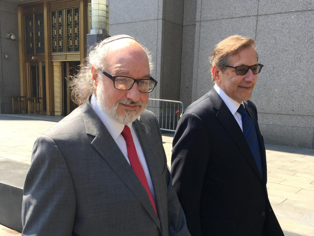 Convicted spy Jonathan Pollard, left, with his lawyer, Eliot Lauer, leaves federal court in New York following a 2016 hearing. The former U.S. Navy analyst who spent three decades in prison after pleading guilty to spying for Israel, has arrived in Israel a month after the Justice Department allowed his parole to expire.