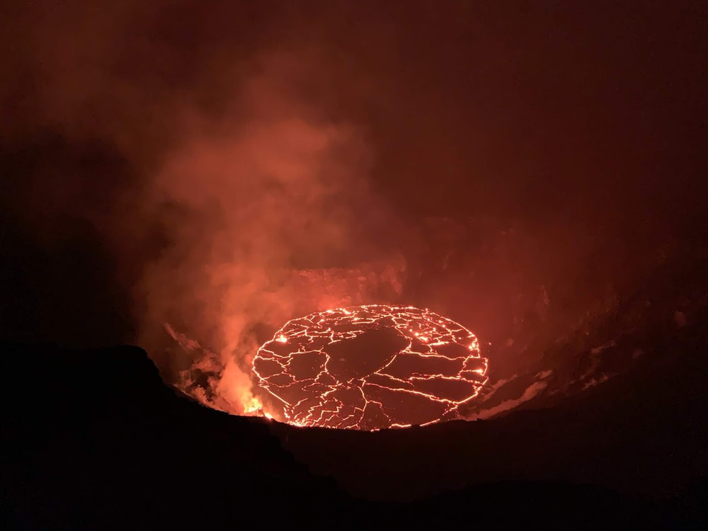 Crews observe the continuing eruption in Halema'uma'u at Kilauea in the early morning of Dec. 28. Overnight, the western vent in the wall of Halema'uma'u continued to erupt.