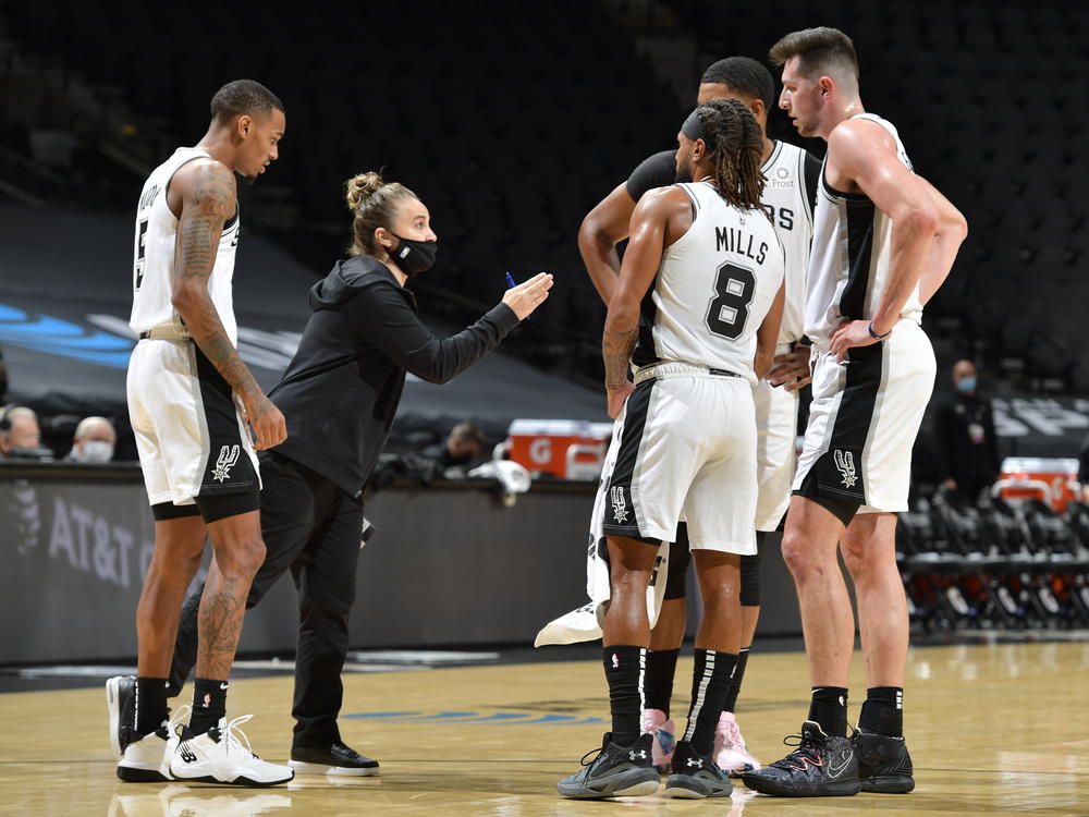 San Antonio Spurs assistant coach Becky Hammon made NBA history Wednesday, becoming the first woman to lead a team in the regular season. She's seen here talking to her players as they faced the Los Angeles Lakers at the AT&T Center in San Antonio.