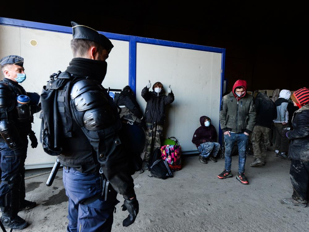 Police break up a rave in Lieuron in northwestern France. Some 2,500 partygoers attended an illegal New Year rave, violently clashing with police who failed to stop it and sparking concern the underground event could spread the coronavirus.