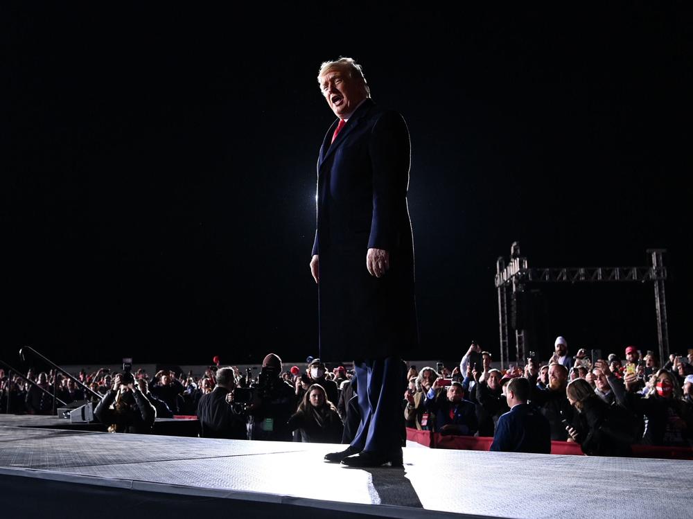 President Trump arrives at a rally in support of Republican incumbent Sens. Kelly Loeffler and David Perdue on Monday evening in Dalton, Ga.