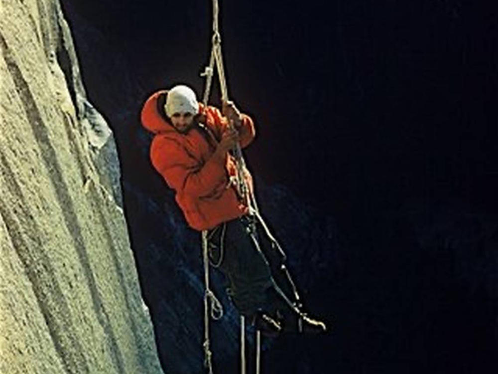 This photo by climbing partner Wayne Merry and provided by the Whitmore Family Trust shows George Whitmore dangling off an outcropping during the historic first ascent of El Capitan in Yosemite National Park in 1958.