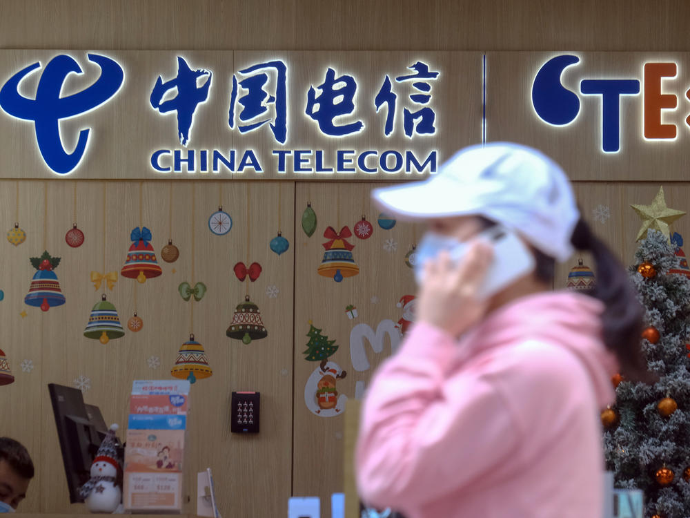 The New York Stock Exchange is backing off plans to delist shares of three Chinese companies, including China Telecom Corp. One of the company's stores is seen here in Hong Kong on Monday.