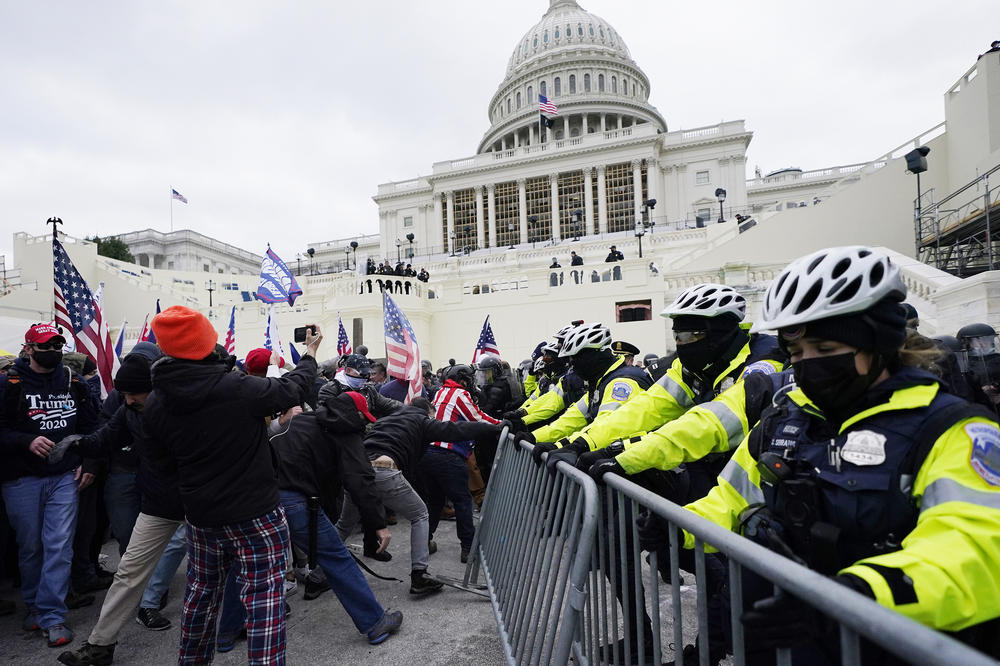 Trump supporters try to break through a police barrier at the Capitol in Washington, D.C., on Wednesday. Protesters later breached security and entered the Capitol.