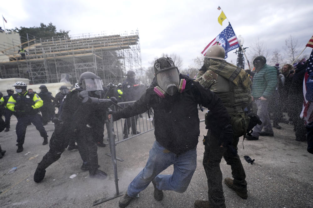 Trump supporters try to break through a police barrier during protests Wednesday at the Capitol.