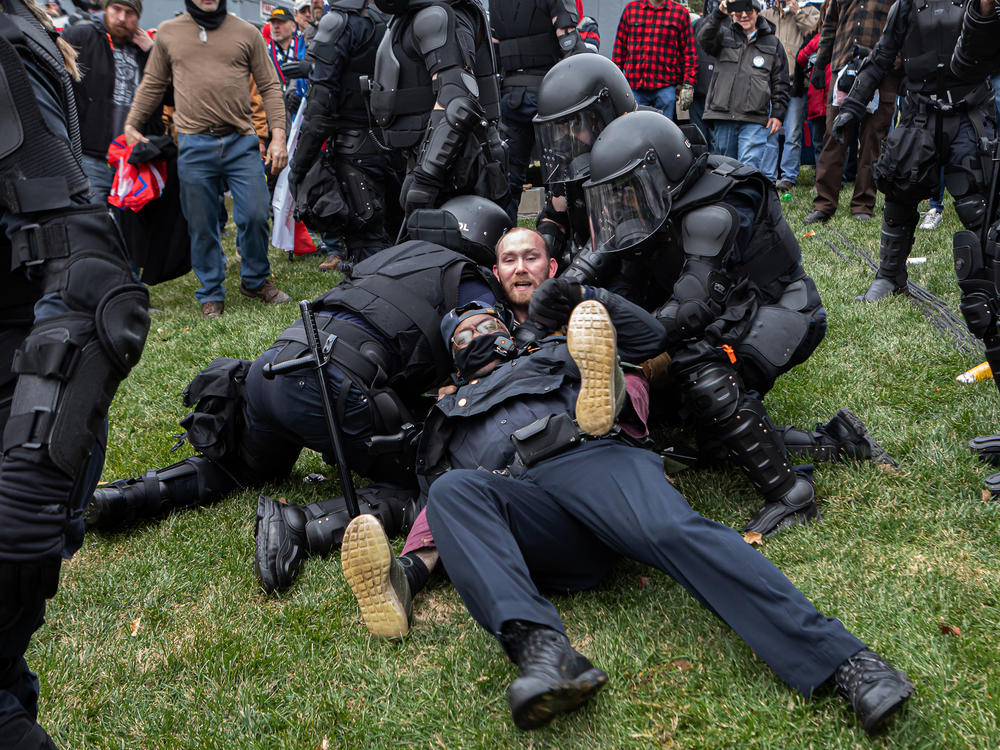 A pro-Trump protester resists arrest on Wednesday. There were few arrests in relation to the scope of the unrest as of Wednesday night.