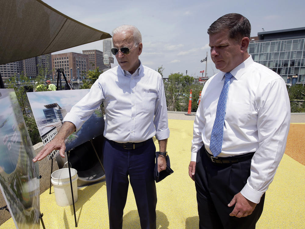 President-elect Joe Biden will nominate Boston Mayor Marty Walsh to be his labor secretary. Here, the two look at renderings for a Boston park in 2019.