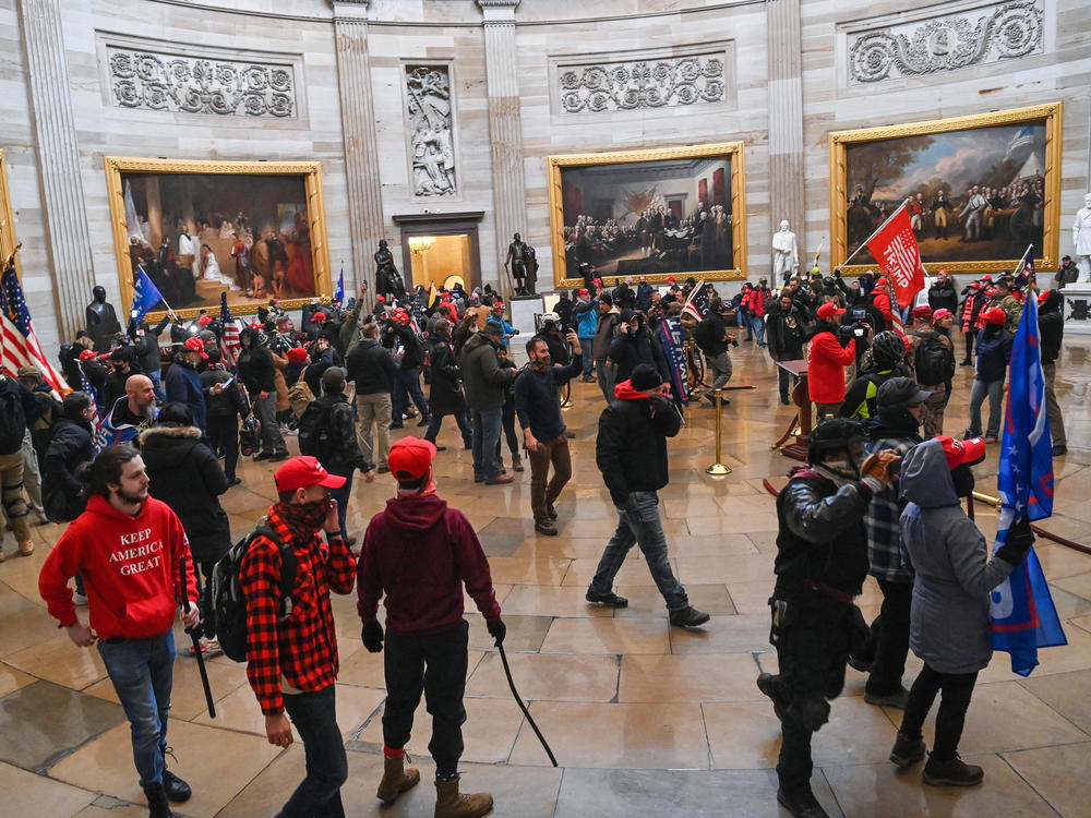 Supporters of President Trump roam the U.S. Capitol Rotunda after storming into the building on Wednesday.