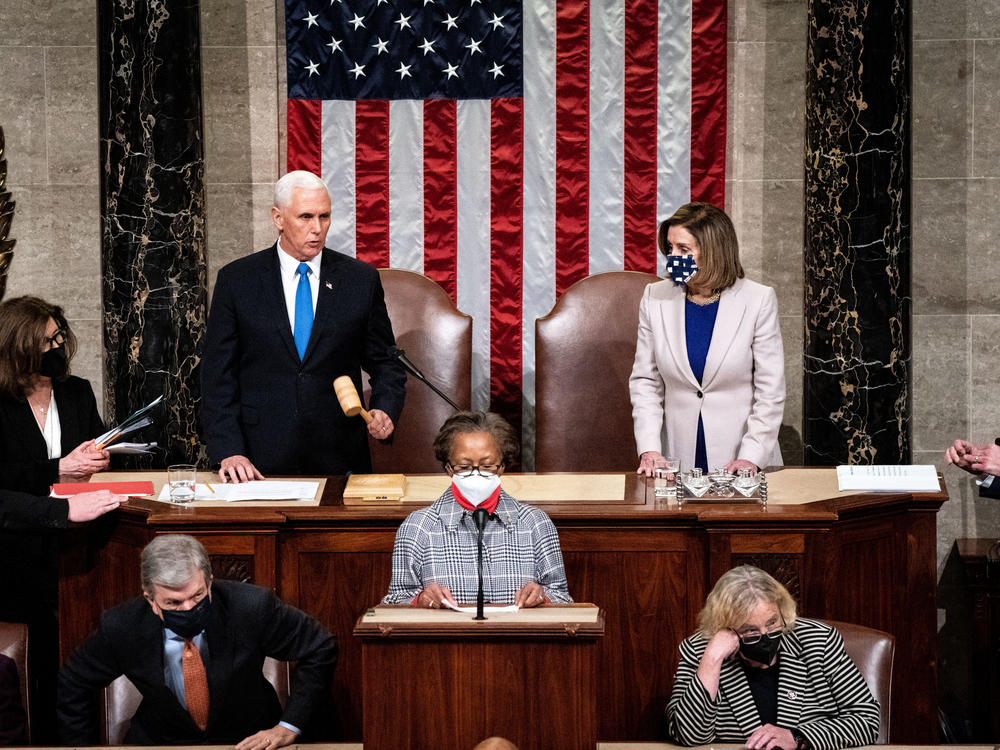 Vice President Pence and House Speaker Nancy Pelosi, D-Calif., preside over a joint session of Congress to ratify President-elect Joe Biden's 306-232 Electoral College win over President Trump, hours after a pro-Trump mob broke into the U.S. Capitol and disrupted proceedings.