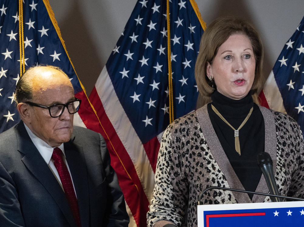 Sidney Powell, right, speaks next to former New York Mayor Rudy Giuliani in November in Washington.