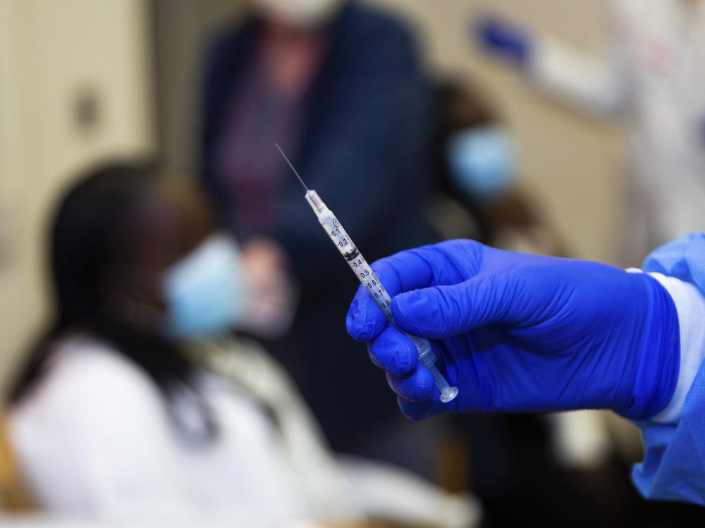 A doctor prepares to administer a vaccine injection at New York-Presbyterian Lawrence Hospital on Friday.