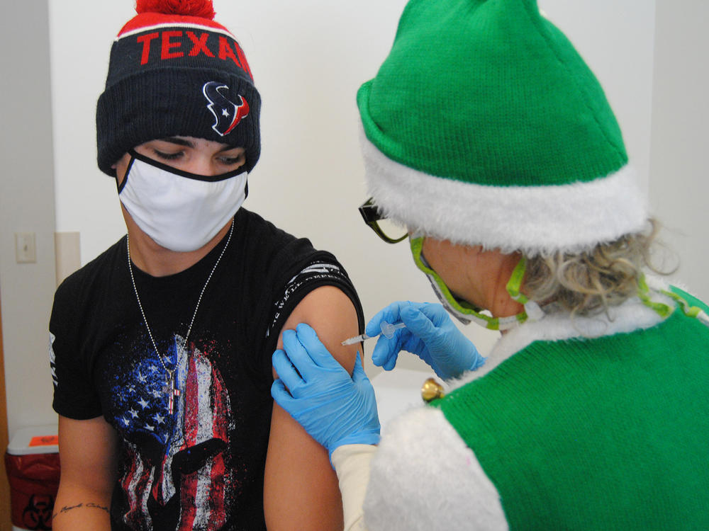 Gene Bracegirdle is relieved to get his first dose of the vaccine recently in rural Colorado.