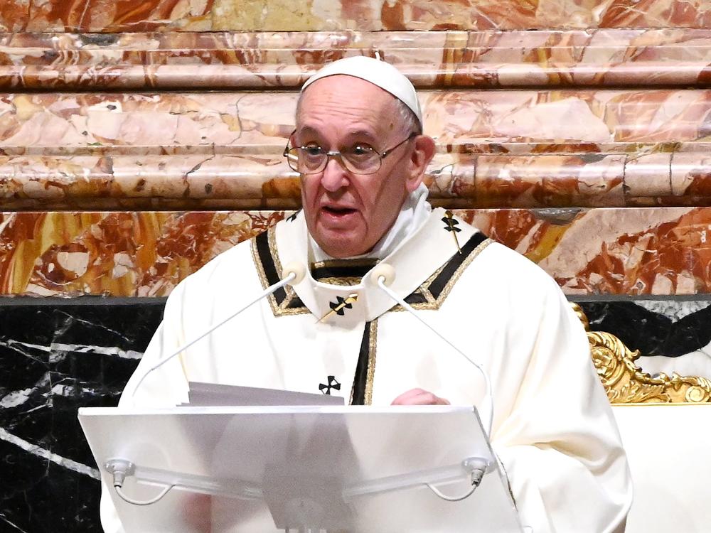 Pope Francis is seen giving a homily on Christmas Eve. Francis on Sunday condemned the violence at the U.S. Capitol and prayed for reconciliation.