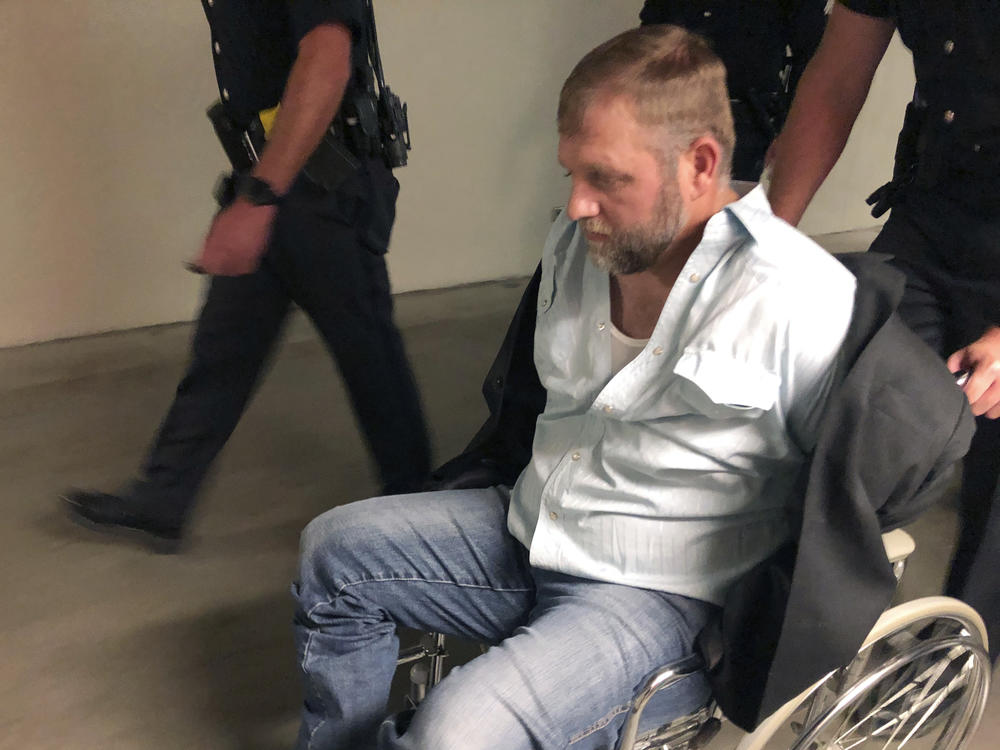 Anti-government activist Ammon Bundy is wheeled from the Idaho Statehouse in Boise, on Aug. 26, 2020. It was his second arrest for trespassing in two days.
