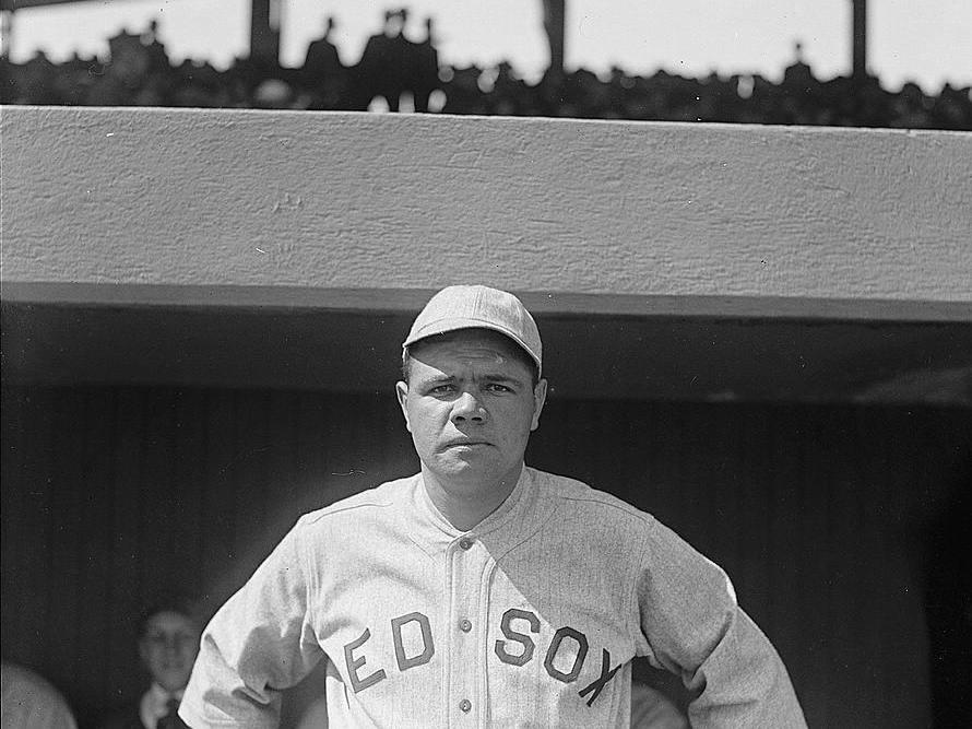 Babe Ruth, a pitcher for the Boston Red Sox, in 1918. That year, World War I and the Spanish flu pandemic slashed MLB game attendance by over half from what it was in the previous season.