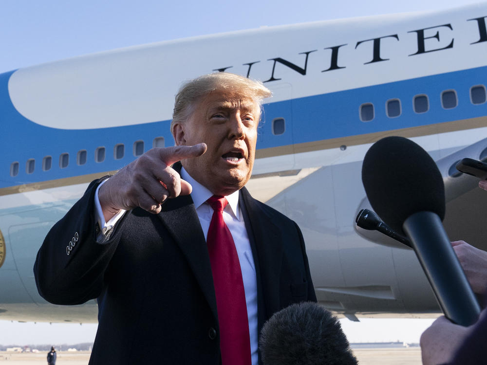 President Trump speaks to reporters before boarding Air Force One on Tuesday. Trump denied culpability for the violence and expressed no regret for comments made last week that many have criticized as being a catalyst for mob violence at the U.S. Capitol.