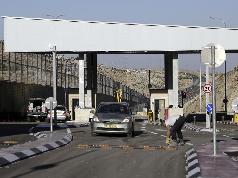 A checkpoint is seen on a West Bank highway near Jerusalem  which critics have branded an 
