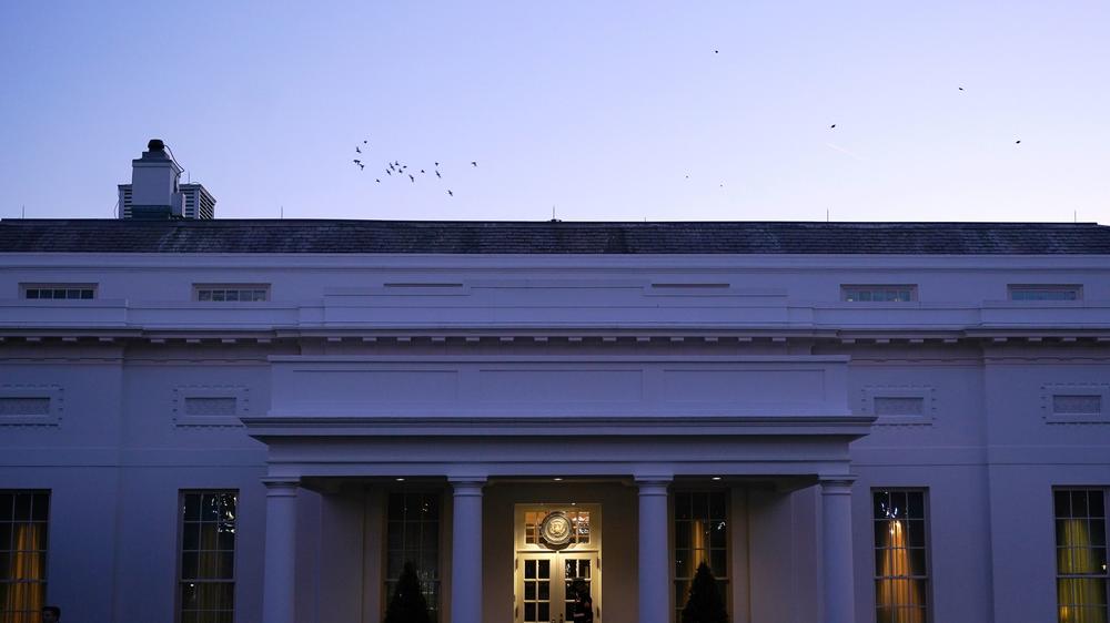 A Marine guards the West Wing of the White House on Wednesday.