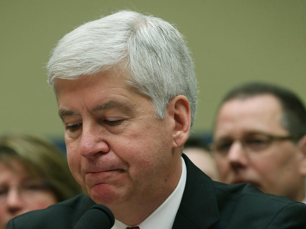 Now Former Michigan Gov. Rick Snyder, (R-MI), listens to Congressional members remarks during a House Oversight and Government Reform Committee hearing, about the Flint, Mich. water crisis in 2016.
