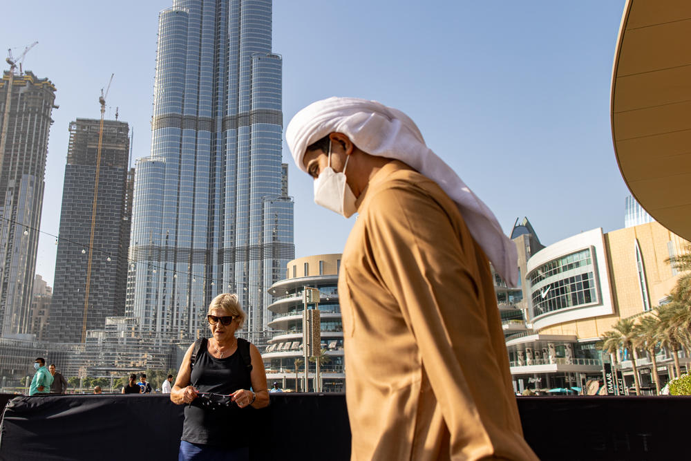 An Emirati man walks past an Israeli tourist at the Burj Khalifa, the world's tallest building, in Dubai, United Arab Emirates, last month.