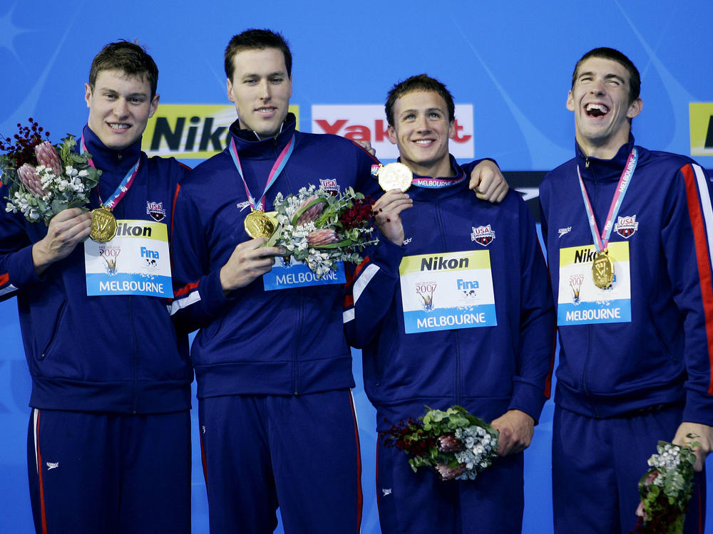 The U.S. men's 4x200-meter freestyle relay team members (from left) Peter Vanderkaay, Keller, Ryan Lochte and Michael Phelps celebrate after winning the gold medal at the World Swimming Championships in Melbourne, Australia, in 2007.