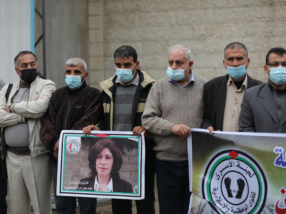 Members of the Palestinian Prisoner Society stage a demonstration outside the International Committee of the Red Cross building, demanding the World Health Organization put pressure on Israeli authorities to vaccinate Palestinian prisoners in Israeli jails, earlier this month in Gaza City.
