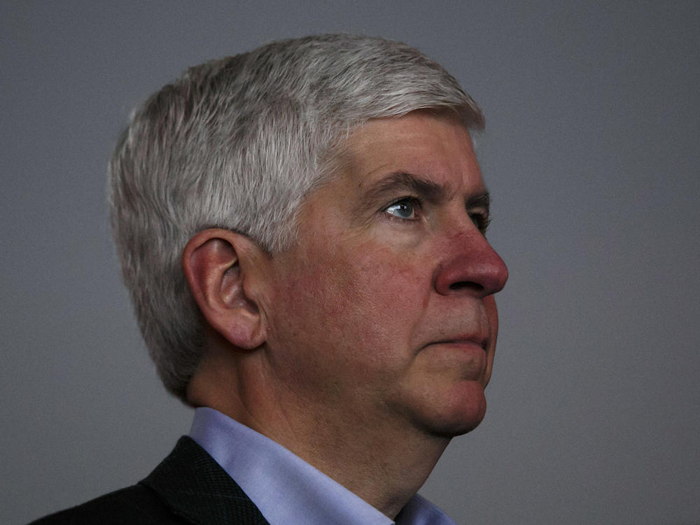 Former Gov. Rick Snyder, seen in 2017, was one of several current and former officials charged by state prosecutors for their role in the lead contamination of drinking water in Flint.