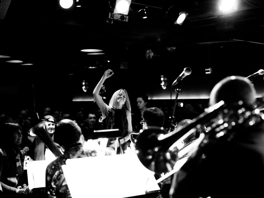 Maria Schneider (center) whose album <em>Data Lords</em> was one of 2020's most acclaimed jazz albums, performs with her orchestra at the New York City club Jazz Standard, where the group had an 16-year annual Thanksgiving week performance that was interrupted by the Covid-19 pandemic.