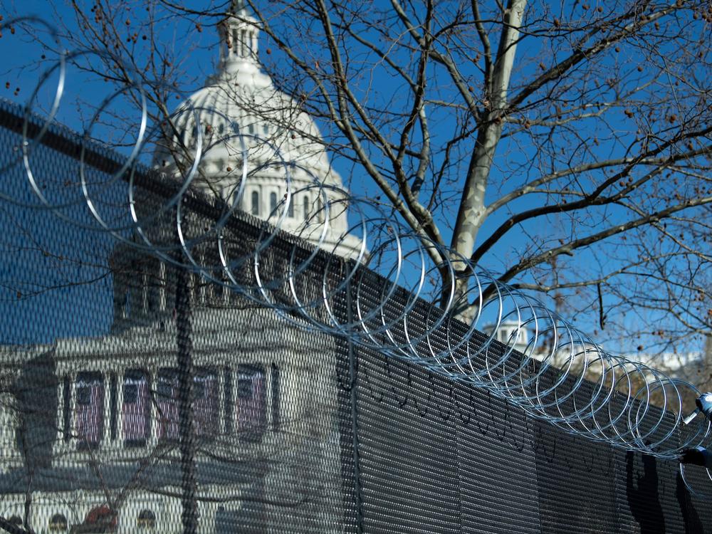 Enhanced security measures, among them razor wire atop a security fence surrounding the U.S. Capitol, are being implemented across the nation in preparation for next week's presidential inauguration.