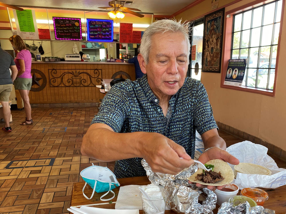 Adán Medrano, chef and food writer, savors a beef cheek taco at Vera's Backyard Bar-B-Que in Texas' Rio Grande Valley.
