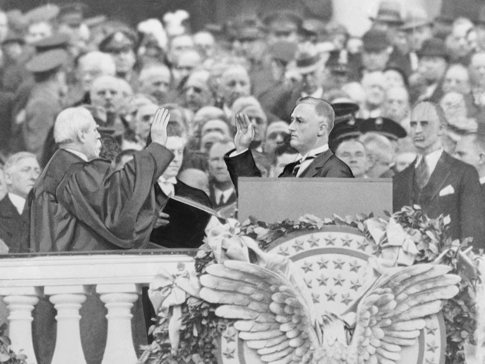 Franklin Delano Roosevelt takes the president's oath of office from Chief Justice Charles Evans Hughes on March 4, 1933.