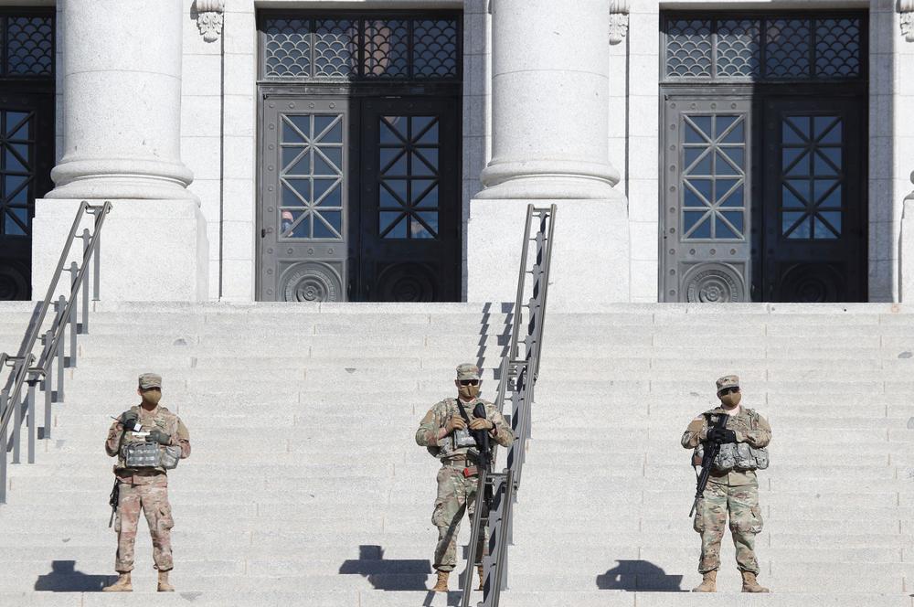 Utah National Guard troops patrol at the Utah State Capitol building during a nationwide protest called by anti-government and far-right groups supporting President Trump.
