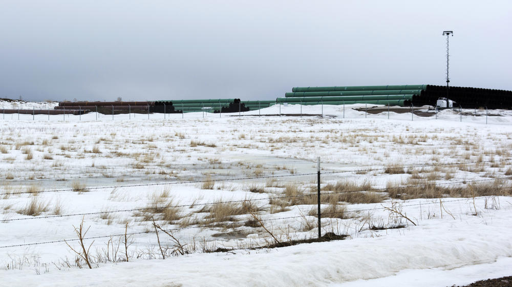 This March 11, 2020 photo provided by the Bureau of Land Management shows a storage yard north of Saco, Mont., for pipe used in construction of the Keystone XL oil pipeline near the U.S.-Canada border.