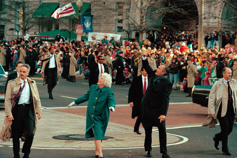 President George H.W. Bush and his wife, first lady Barbara Bush, acknowledge the crowd on Pennsylvania Avenue after getting out of their limousine and walking the inaugural parade route in Washington, D.C.. Earlier, Bush was sworn in as the 41st president of the United States.