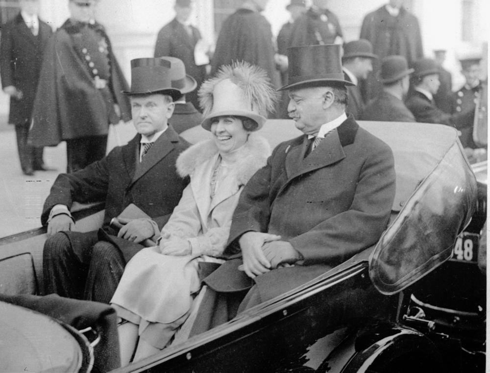 Calvin Coolidge (left) wears wing collar and muted top hat en route to take oath on Inauguration Day, March 4, 1925.