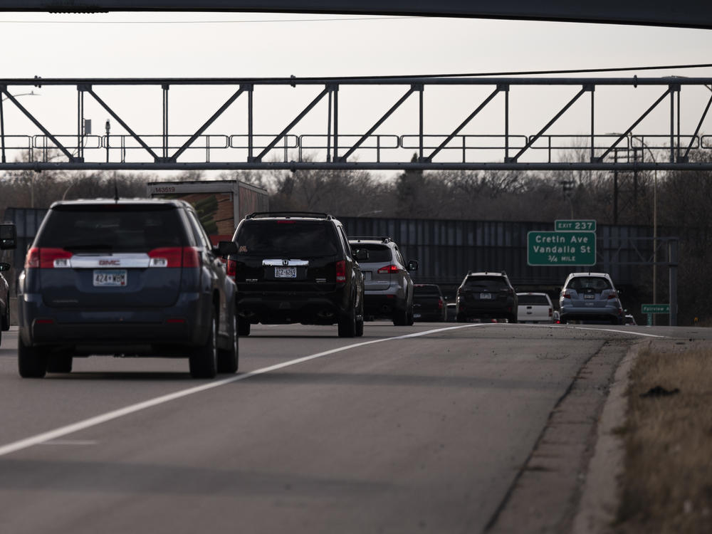 Vehicles drive on highway I-94 in St. Paul, Minn., on Nov. 7, 2020. A recent report from the International Energy Agency said emissions fell across most parts of the economy, with one notable exception: SUVs.
