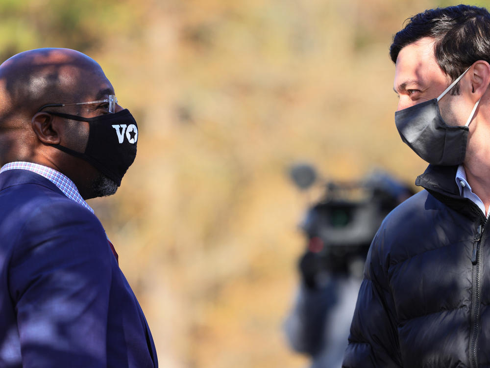 The Rev. Raphael Warnock and Jon Ossoff, seen here during a campaign event in Georgia on Jan. 4, were sworn in as U.S. senators by Vice President Harris on Wednesday afternoon.