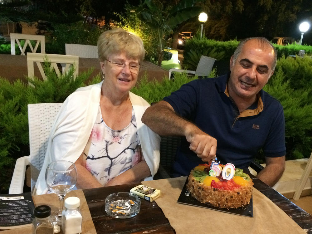 Pamela and Afshin Raghebi celebrate a birthday together. Afshin, who was born in Iran, has been stuck overseas, away from his U.S. citizen wife, for more than two years after he flew abroad for an interview at a U.S. Consulate as part of his green card application.