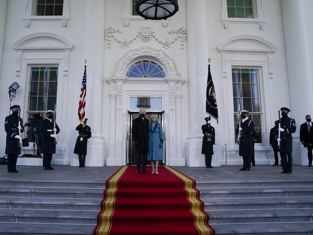 President Joe Biden stands with first lady Jill Biden as they prepare to walk into the White House after being sworn in as the 46th president.