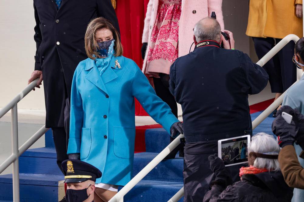 House Speaker Nancy Pelosi's brilliant blue coat appeared to have weathered a few snow flurries ahead of the inauguration ceremony.