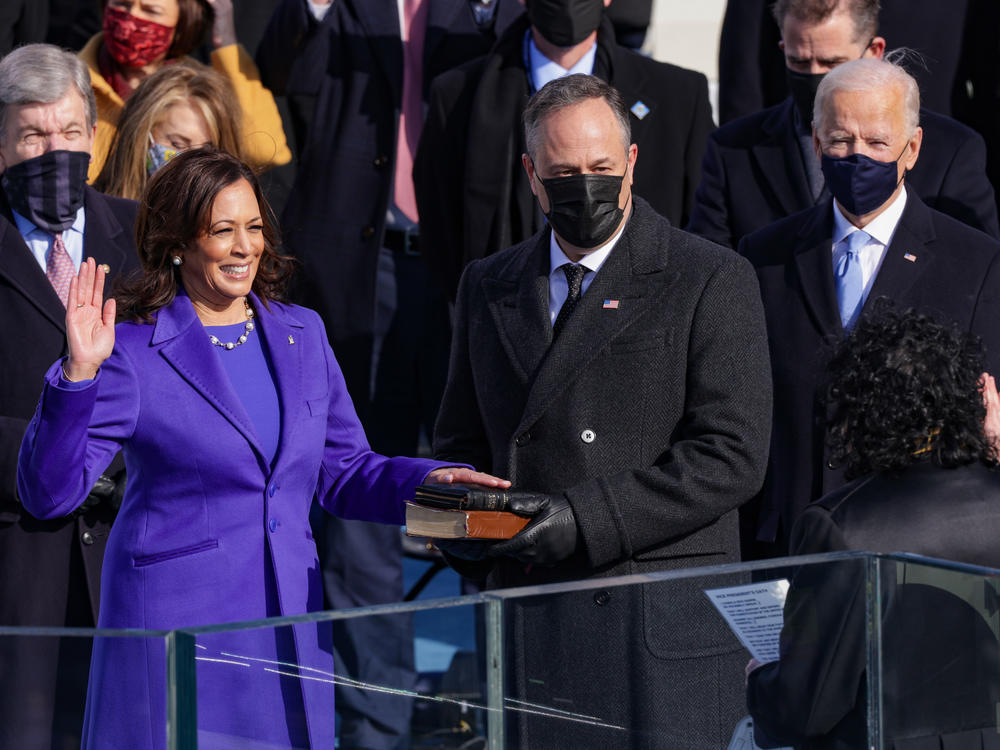 Kamala Harris is sworn as vice president by U.S. Supreme Court Associate Justice Sonia Sotomayor as her husband Doug Emhoff looks on.