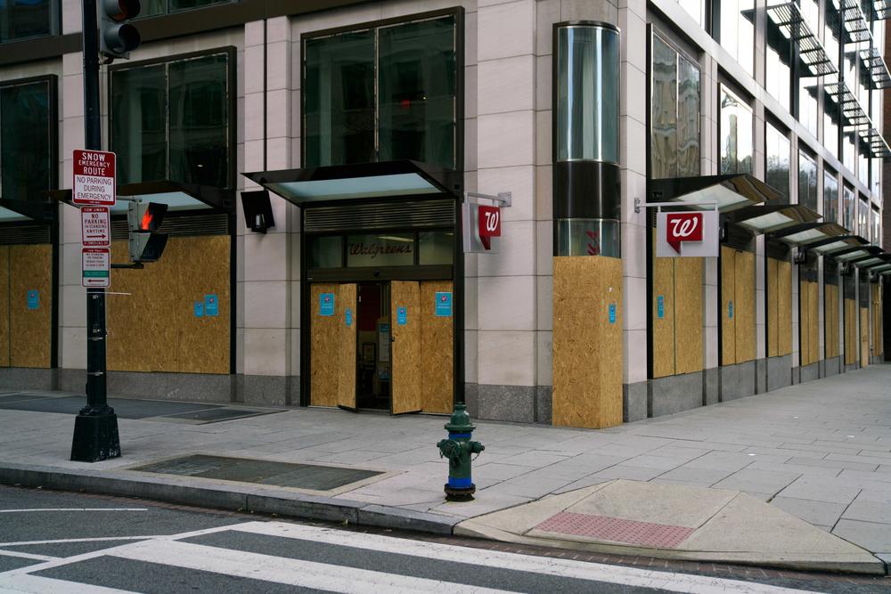 A Walgreens is boarded up in a nearly empty part of downtown Washington, D.C., on Wednesday.