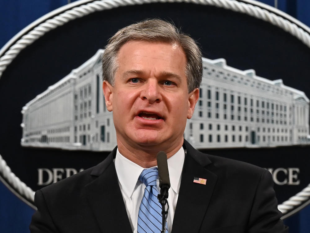 FBI Director Christopher Wray addresses a press conference at the Justice Department in October.
