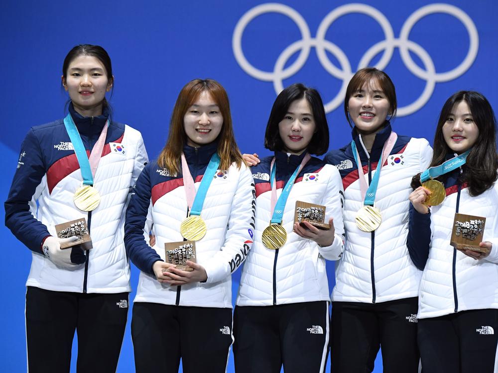 South Korean gold medalist Shim Suk-hee (far left), shown with her relay teammates during the 2018 Winter Olympics in Pyeongchang, South Korea, accused her former coach of repeated sexual assault.